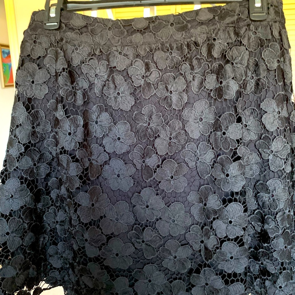 Beautiful black skirt with flowers hand sewn on the front